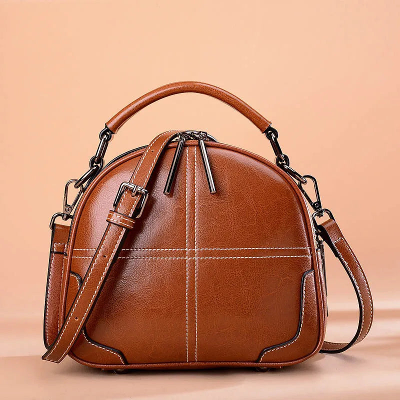 Round leather handbag with zipper and double soft handles in multiple colour options