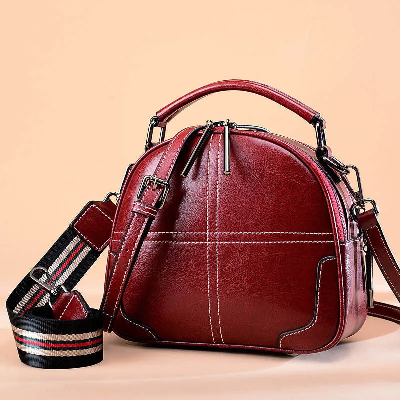 Round leather handbag with zipper and double soft handles in multiple colour options