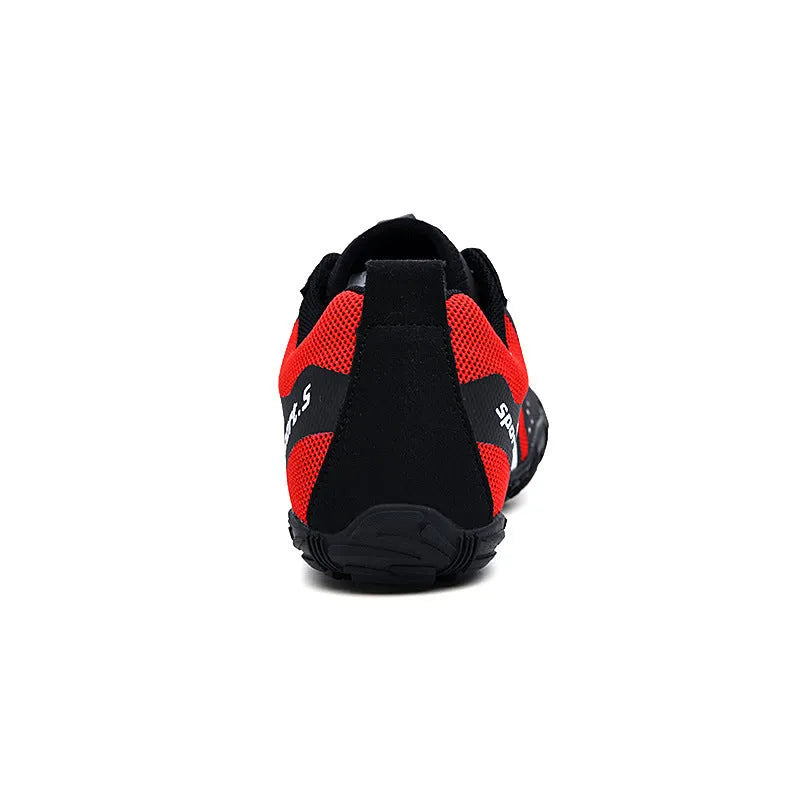 Outdoor quick-drying wading shoes in red with mesh upper and rubber sole on a sandy beach.