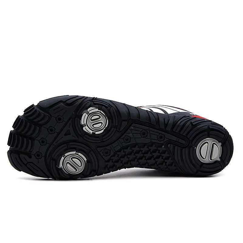 Outdoor quick-drying wading shoes in red with mesh upper and rubber sole on a sandy beach.