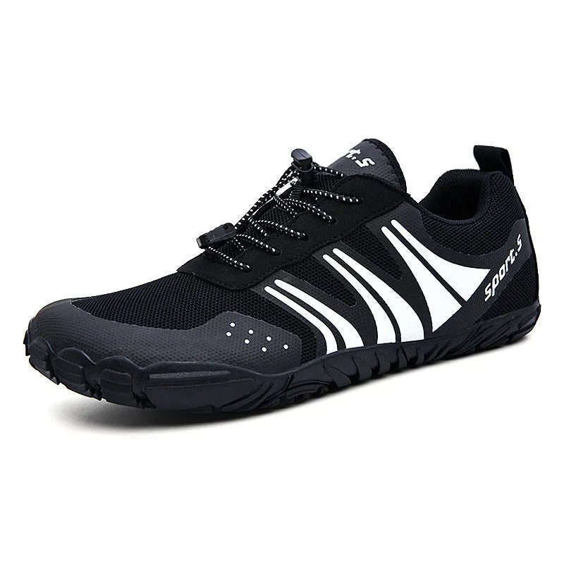 Outdoor quick-drying wading shoes in red with mesh upper and rubber sole on a sandy beach.