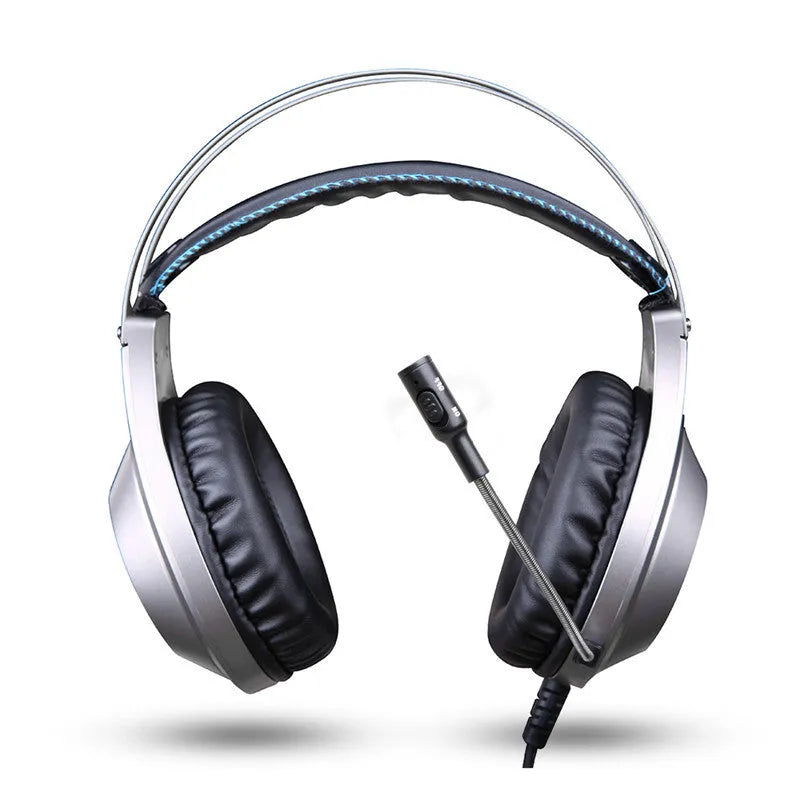 Black wired USB computer headset with over-ear cups and an integrated microphone on a PC desk.