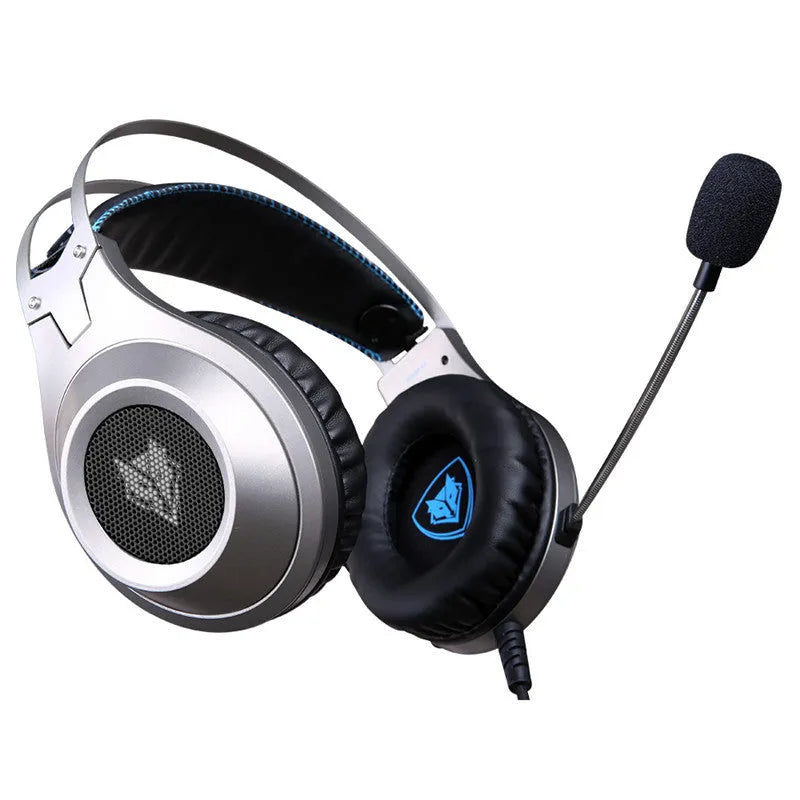Black wired USB computer headset with over-ear cups and an integrated microphone on a PC desk.