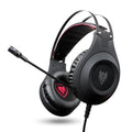 Black wired USB computer headset with over-ear cups and an integrated microphone on a PC desk.