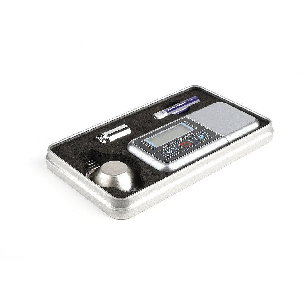Digital precision scale with 100g capacity and 0.005g resolution on a dark surface