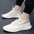 Men's white mesh sports trainers with round toe and rubber sole on neutral background