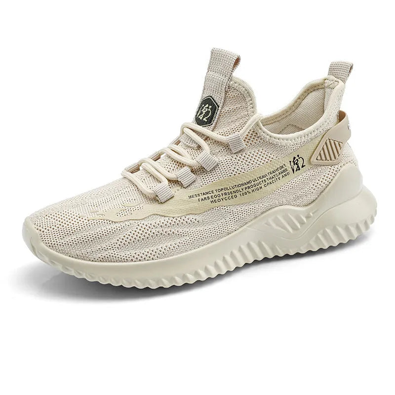 Men's white mesh sports trainers with round toe and rubber sole on neutral background