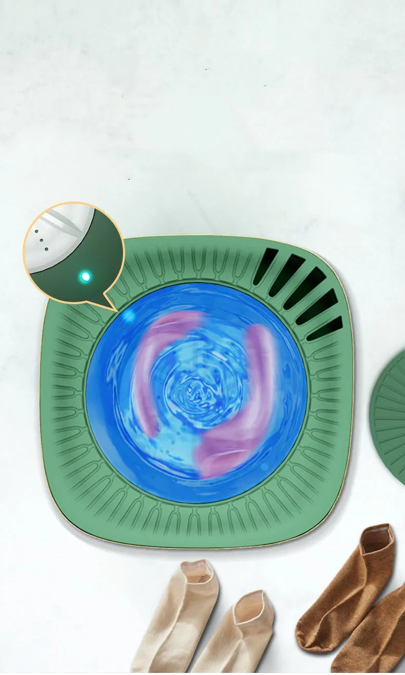 Green mini portable washing machine for underwear with ozone sterilisation and 300mL capacity.