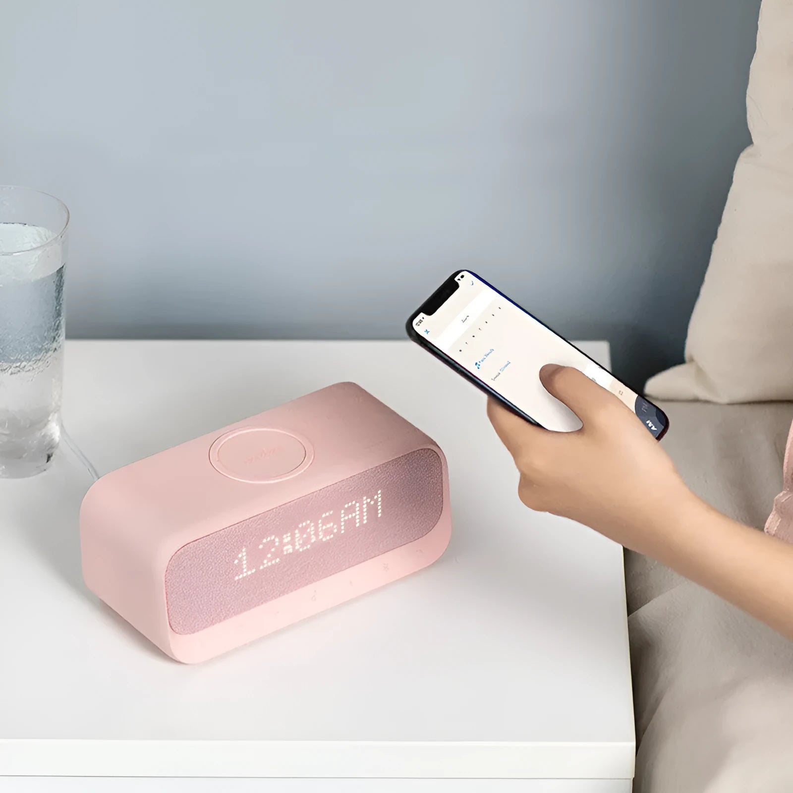 Anker Soundcore white Bluetooth speaker alarm clock with wireless charging pad on top