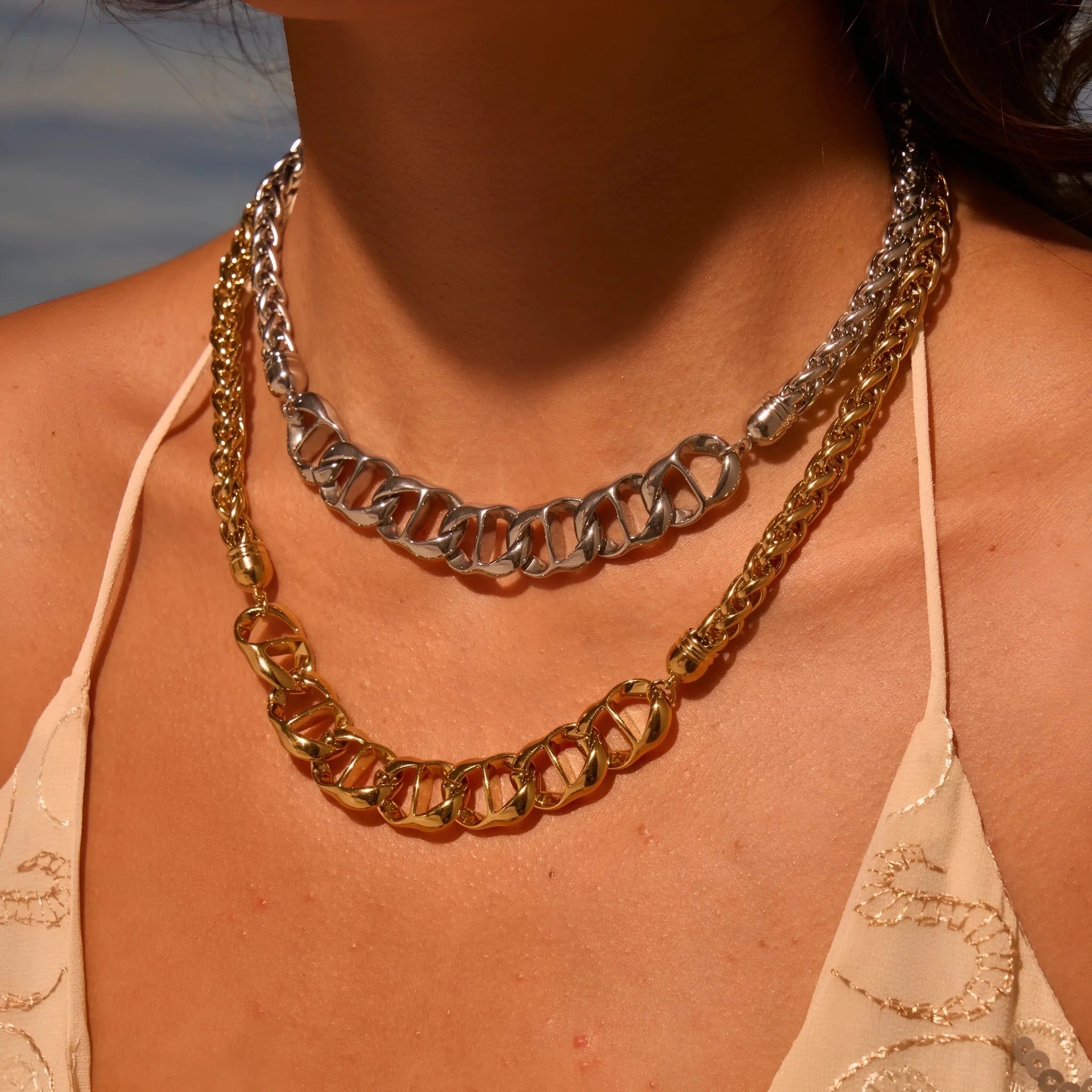 Stainless steel geometric pendant necklace with gold plating on regular chain