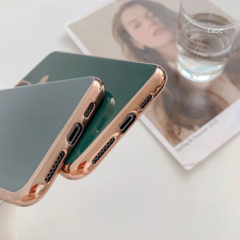 TPU iPhone case with solid colour and a raised metallic love heart design on the back.