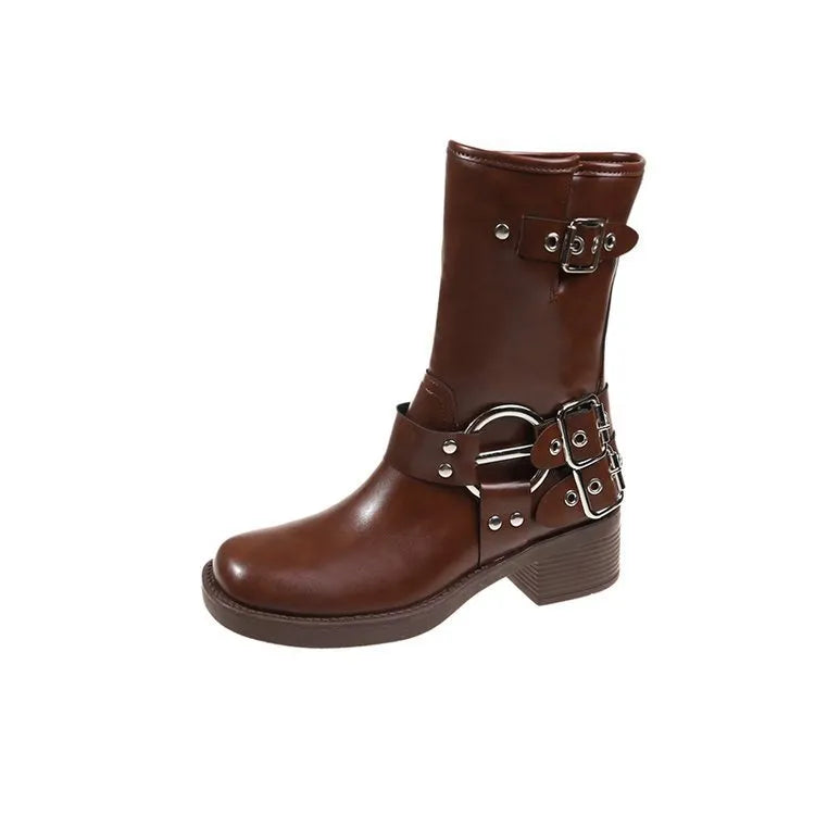 Black and brown women's platform boots with buckle details on the calf.
