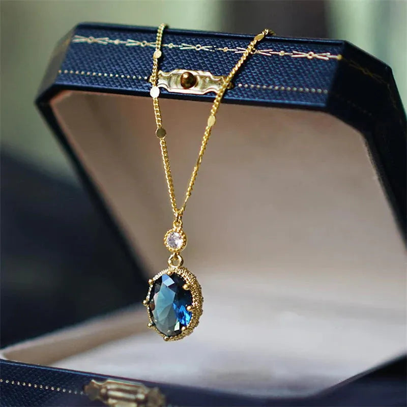 Gold geometric copper pendant on a French retro unisex necklace.