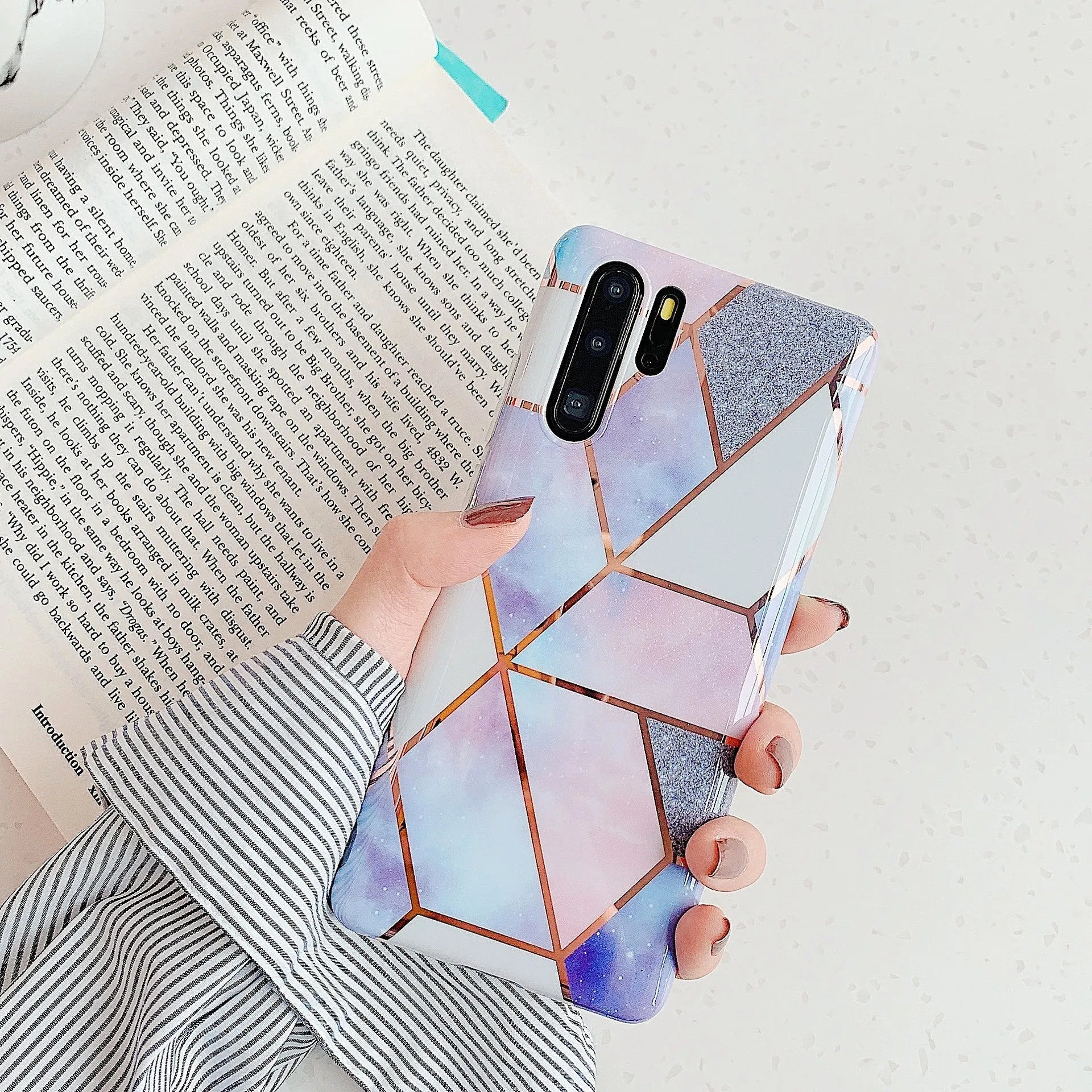 Electroplated marble pattern mobile phone case showing multiple colour options for Huawei and Samsung smartphones