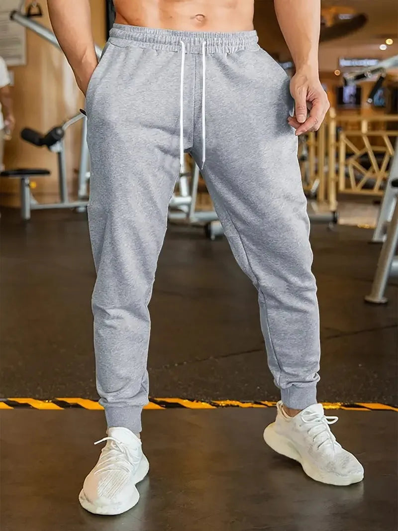 Men's linen-style leisure trousers with elastic drawstring waistband and loose fit design