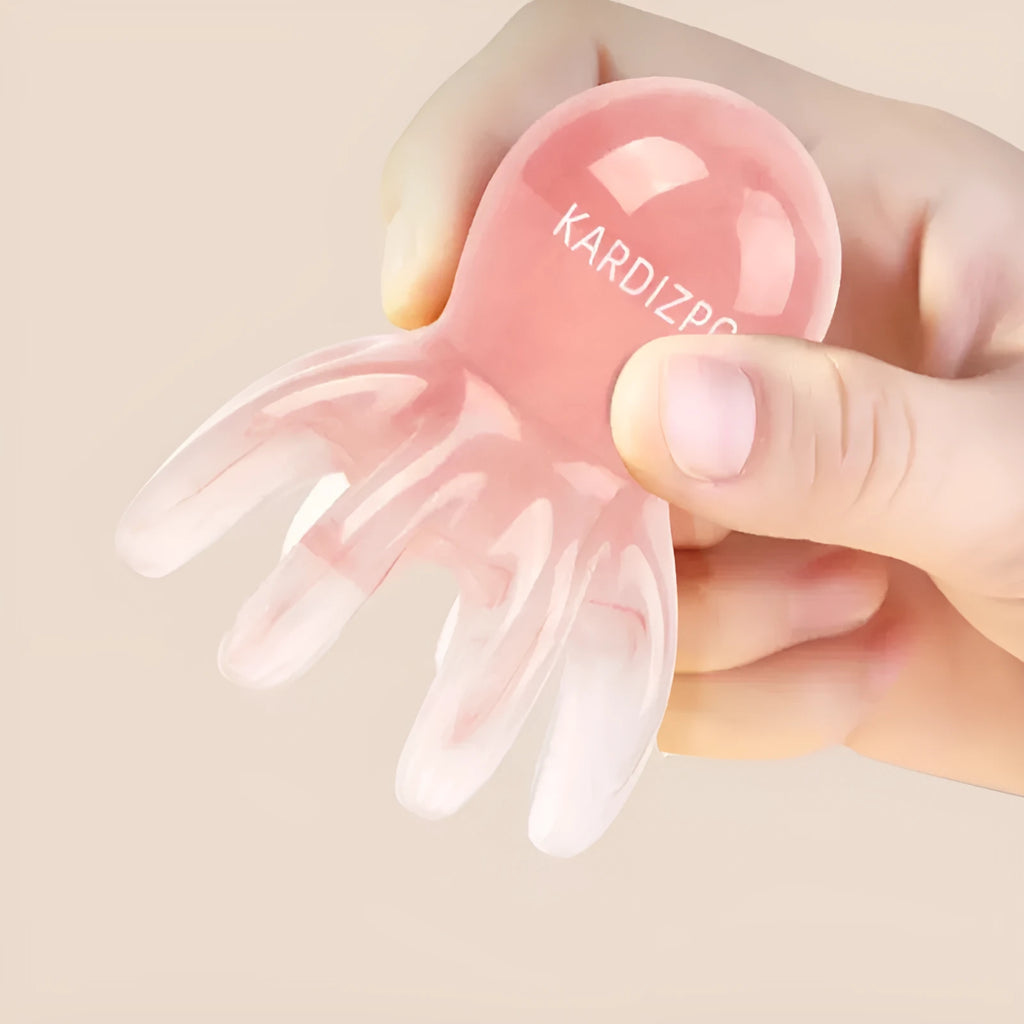 Small pink octopus-shaped natural resin massage comb with storage bag.