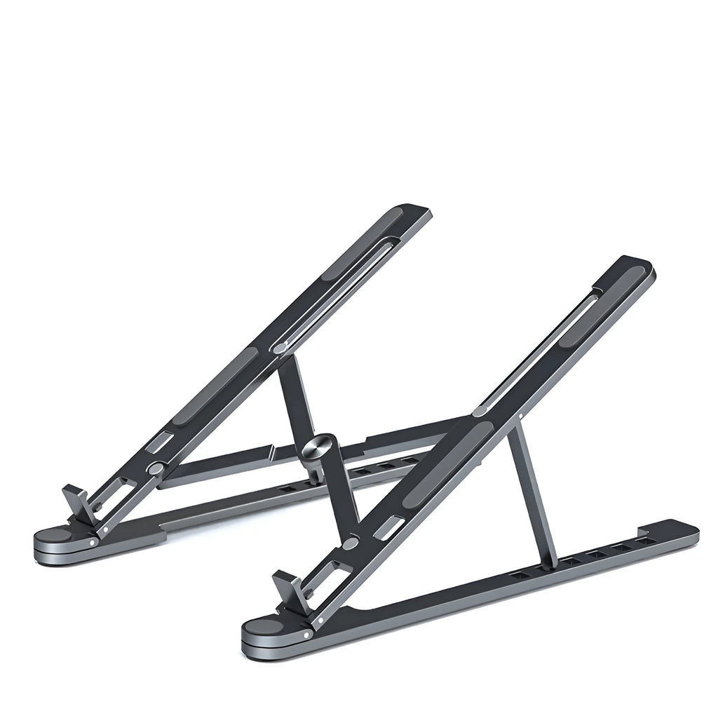 Aluminium laptop stand in silver colour, folded flat next to an open laptop for size comparison.
