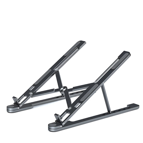 Aluminium laptop stand in silver colour, folded flat next to an open laptop for size comparison.