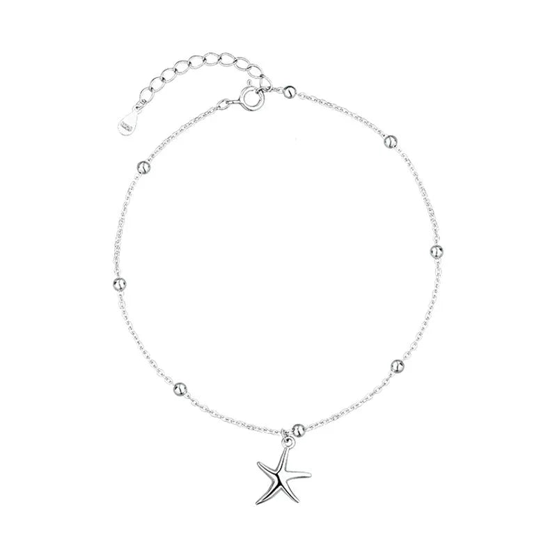 Sterling silver anklet with round beads and small starfish charm on ankle