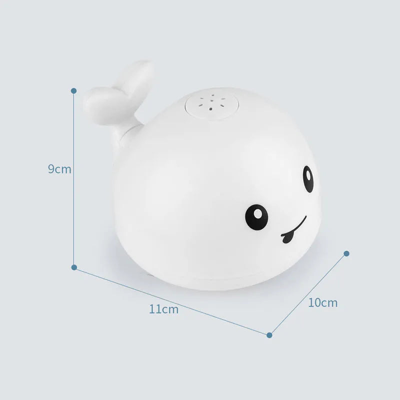 Electric whale-shaped baby bath toy with water spray, LED lights, and automatic water sensor