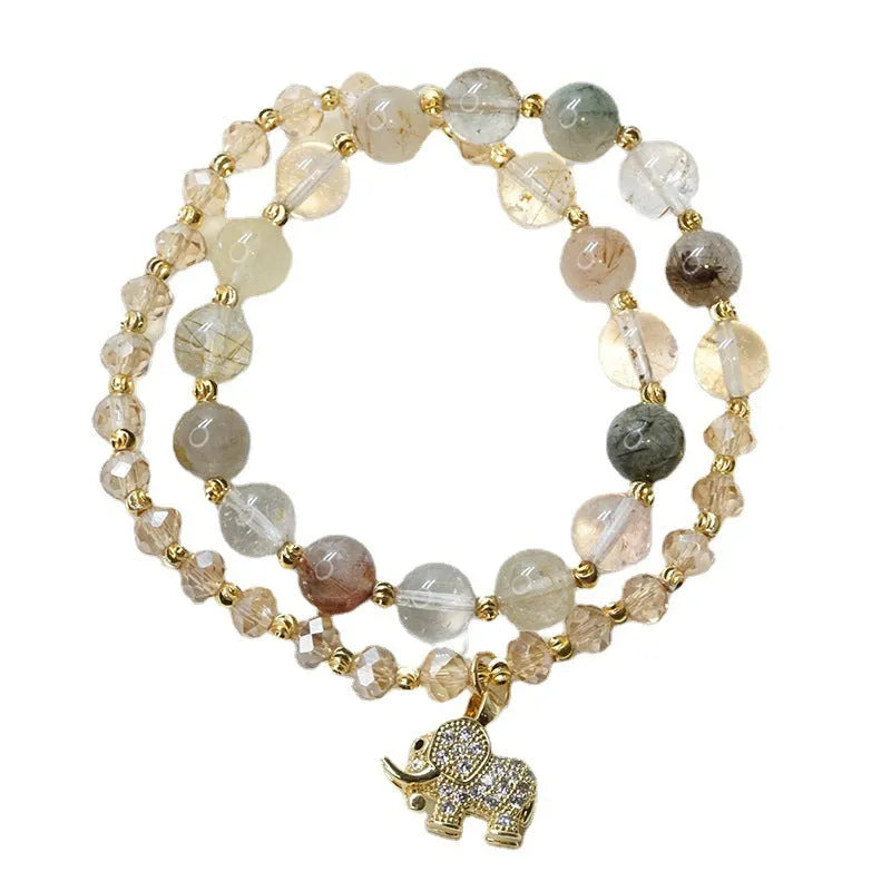 Women's retro bracelet in colour hair crystal or strawberry quartz with ethnic design elements