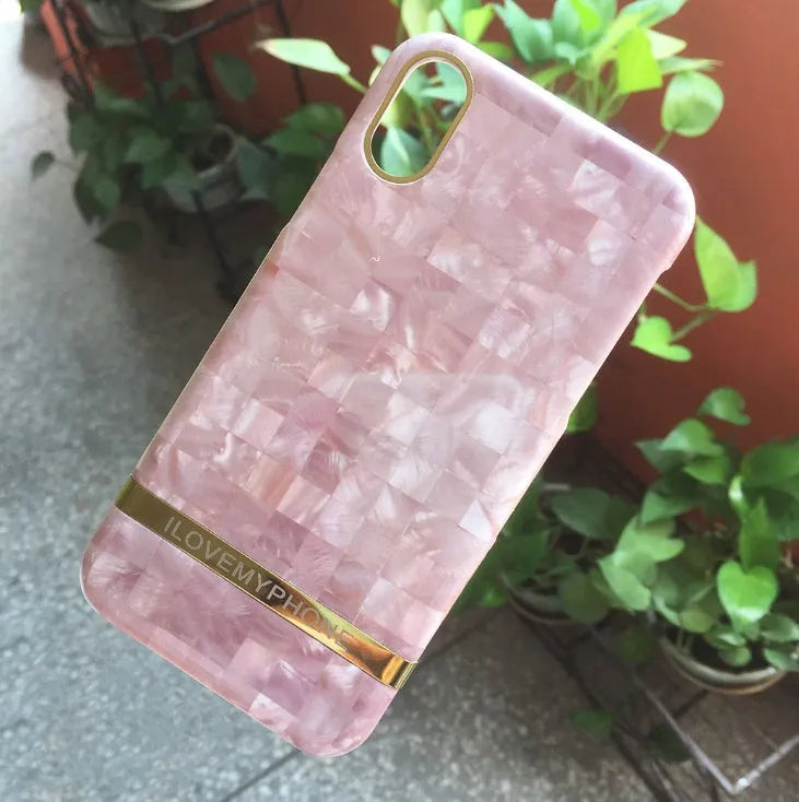 Marble pattern plastic case for iPhone on a table, shown in multiple colour options.