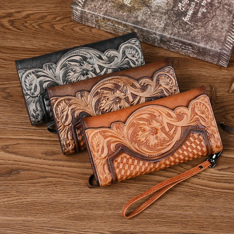 Retro brown floral embossed tri-fold leather wallet open to show interior compartments.