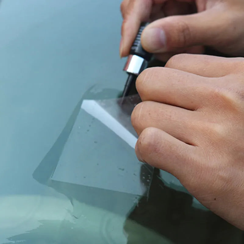Yellow three-piece car windshield repair agent tool set on a white background.