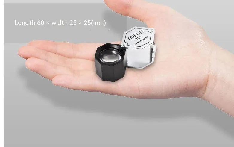 Handheld jeweller's loupe with metal frame and optical glass lenses for 10x to 30x magnification