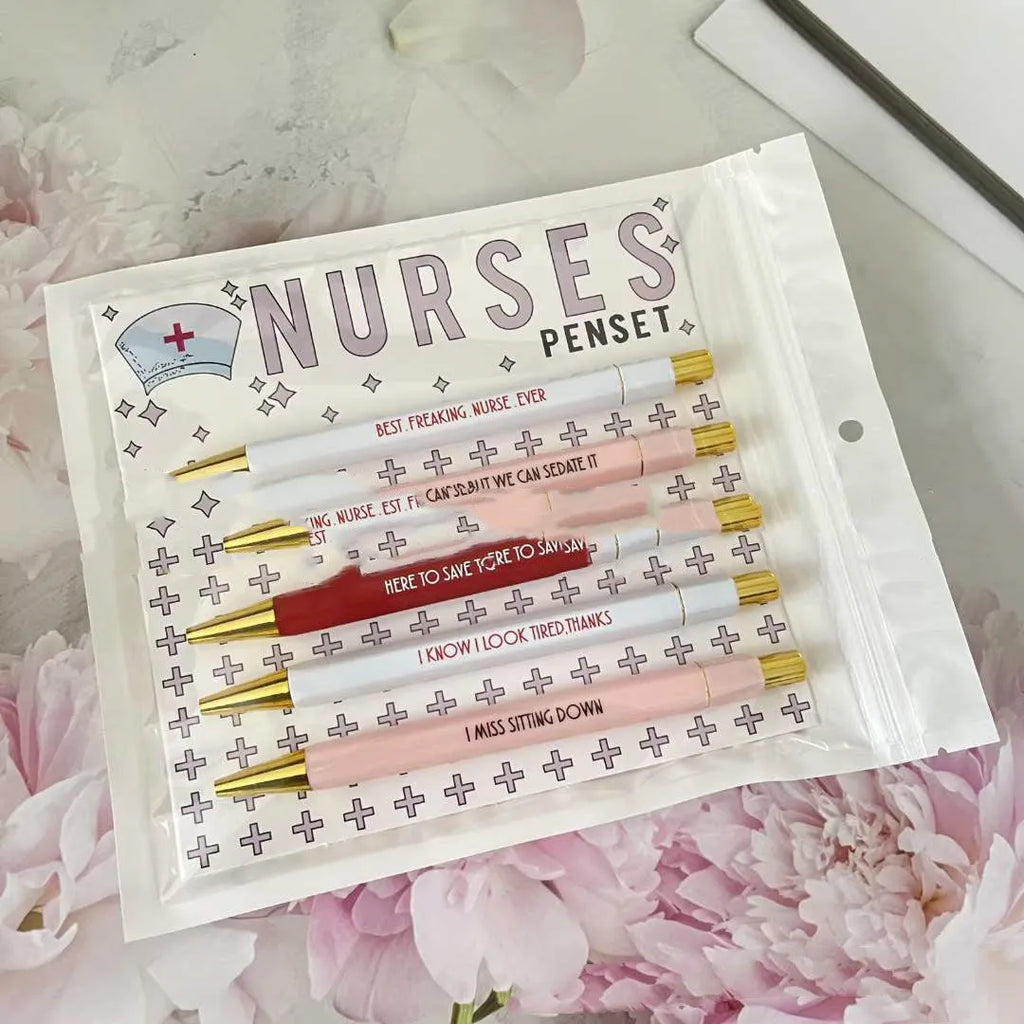 Five nurse-themed ballpoint pens with humorous medical copywriting on plastic barrels