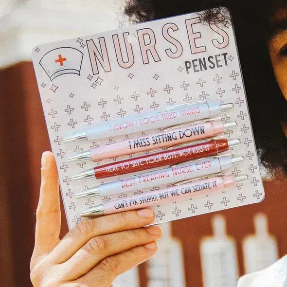 Five nurse-themed ballpoint pens with humorous medical copywriting on plastic barrels