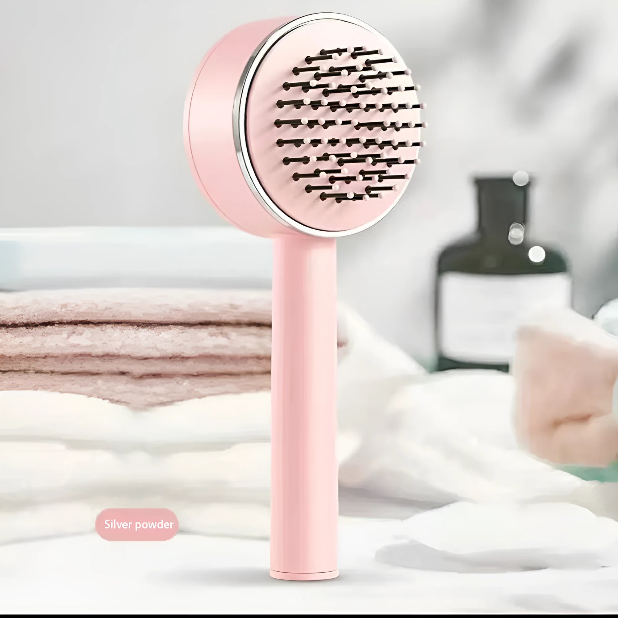 One-key self-cleaning hair brush with green airbag massage comb and non-slip handle on white background