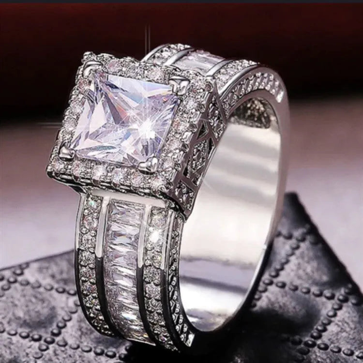 Geometric silver fashion ring for women in gold or white electroplated alloy, showing round design elements.