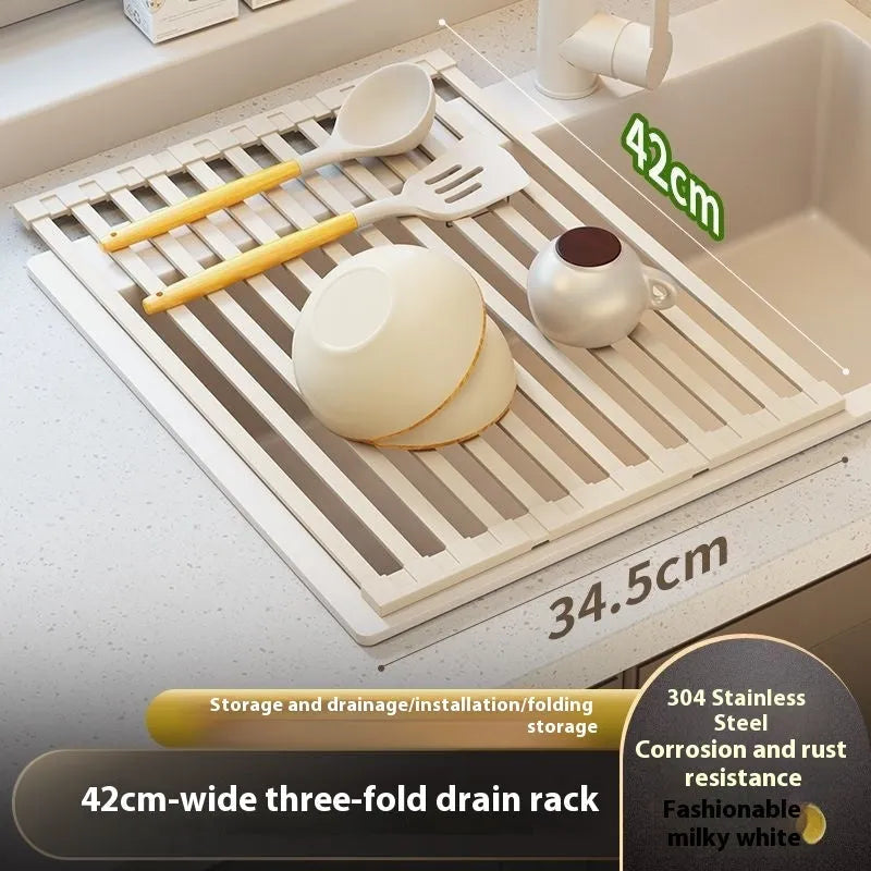 Milky white foldable stainless steel kitchen draining rack next to a sink.