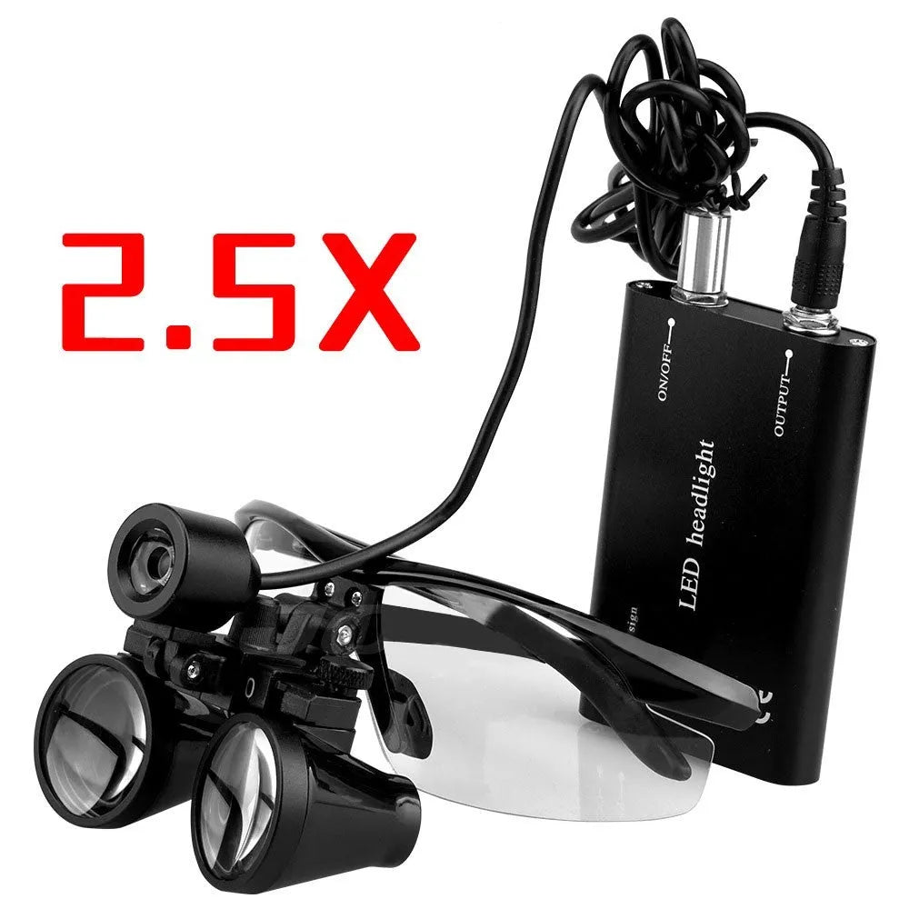 Black head-mounted dental magnifier with LED light showing 2.5X glasses and 3.5X interchangeable lens
