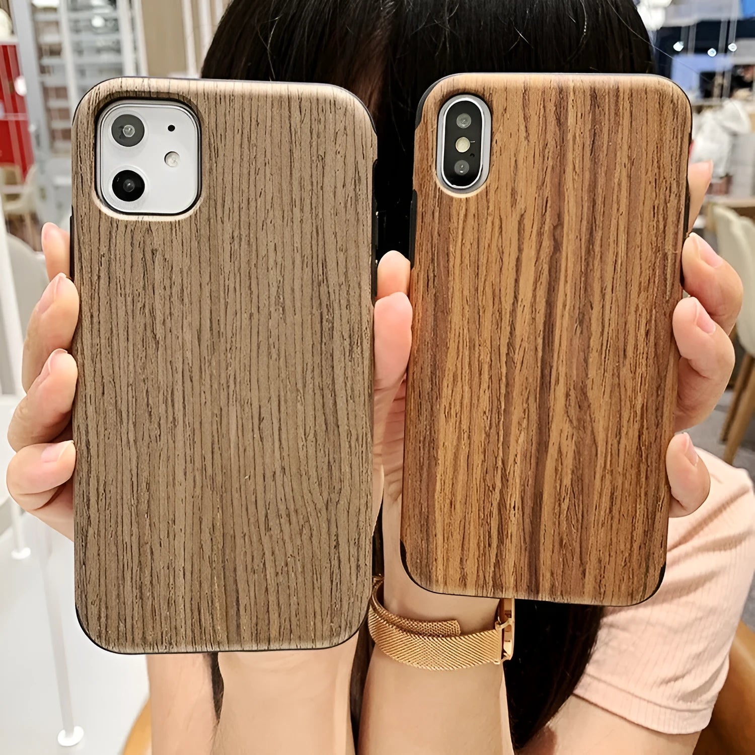 Natural wood grain iPhone back cover case in rosewood finish next to an iPhone