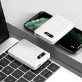 Black and white plastic power bank with USB ports and 10000mAh capacity