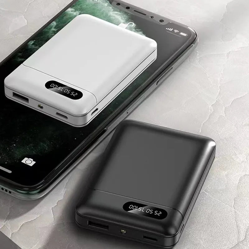 Black and white plastic power bank with USB ports and 10000mAh capacity