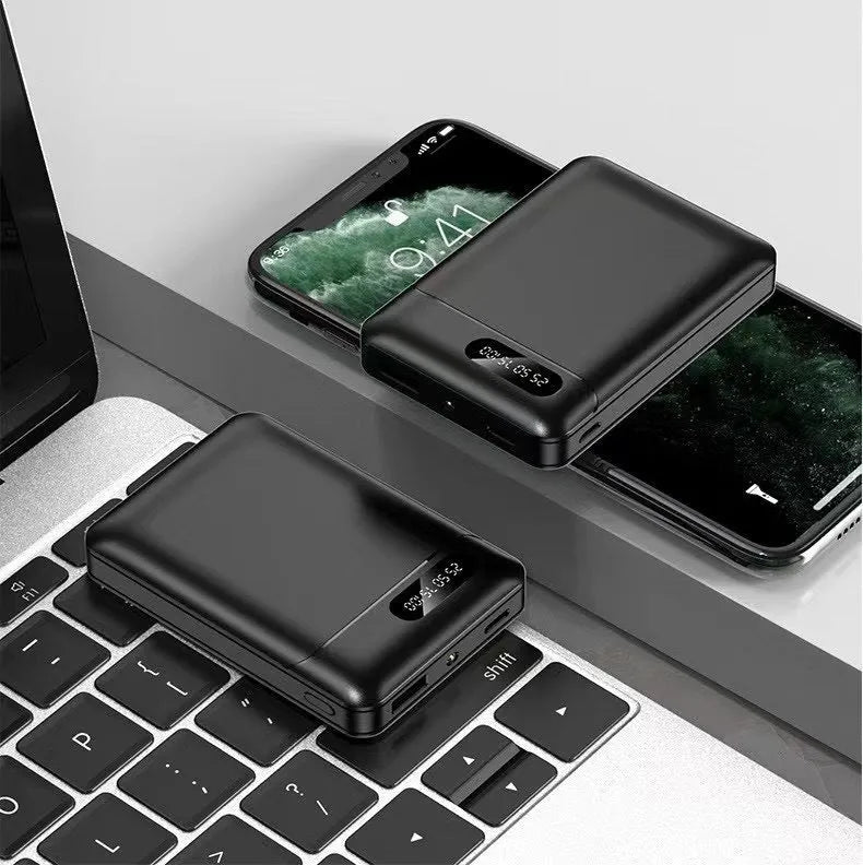 Black and white plastic power bank with USB ports and 10000mAh capacity