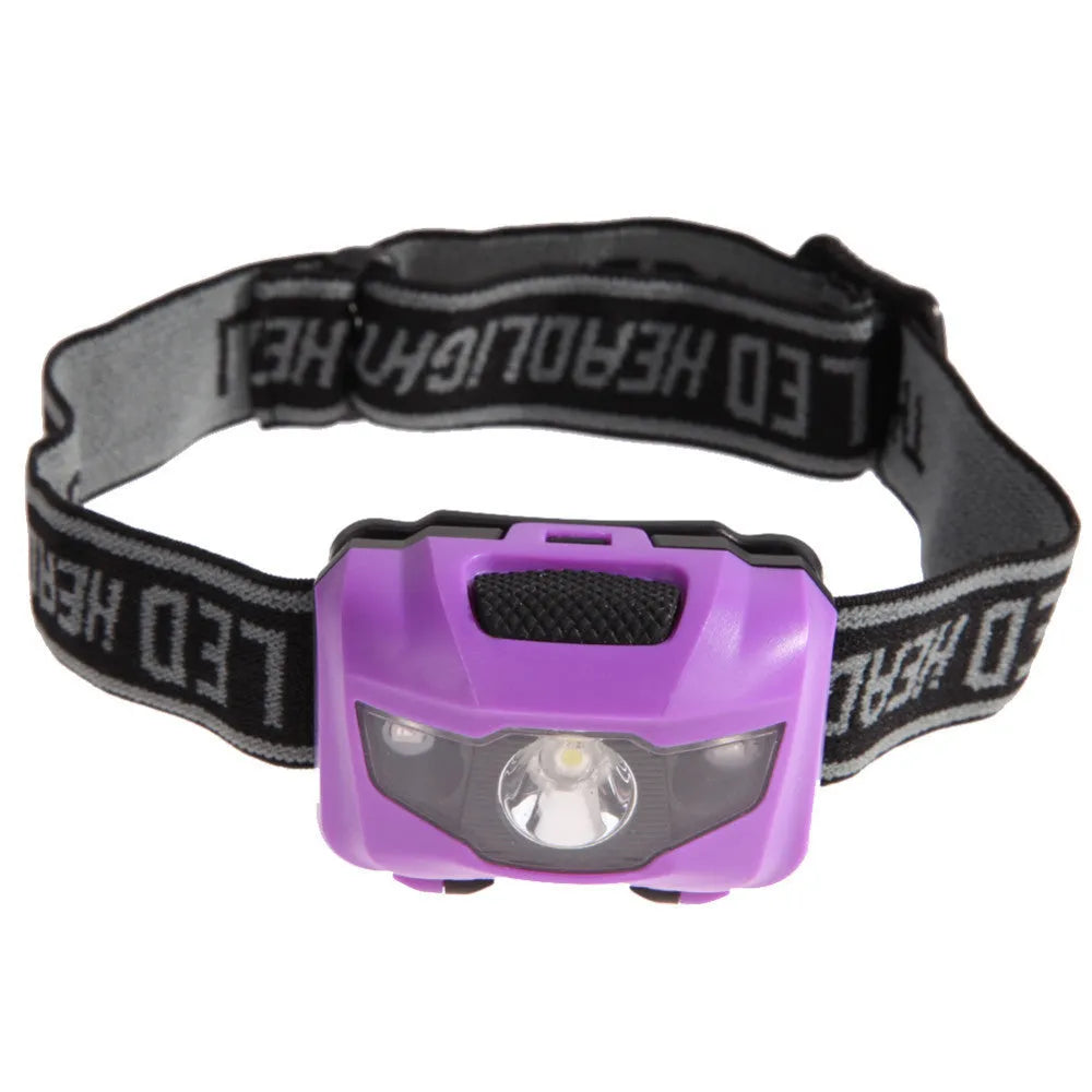 Black head torch with white and red LEDs mounted on adjustable headband for outdoor use
