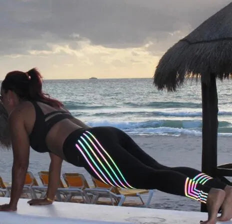 Women's high-waist workout leggings with glowing night print in black and white colours