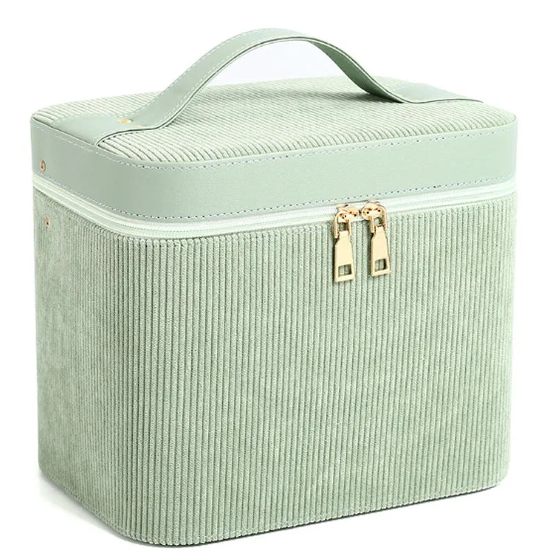 Corduroy cosmetic storage box with large capacity, shown in a solid colour with textured fabric exterior.