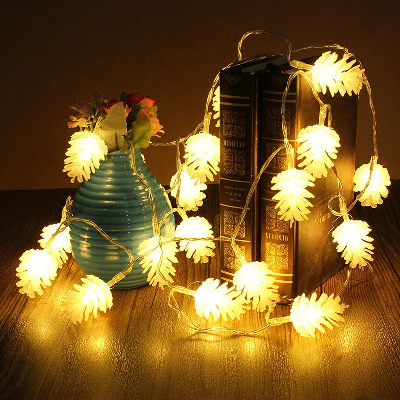 Battery-powered LED pine cone light string in warm white with plastic pine cone shells