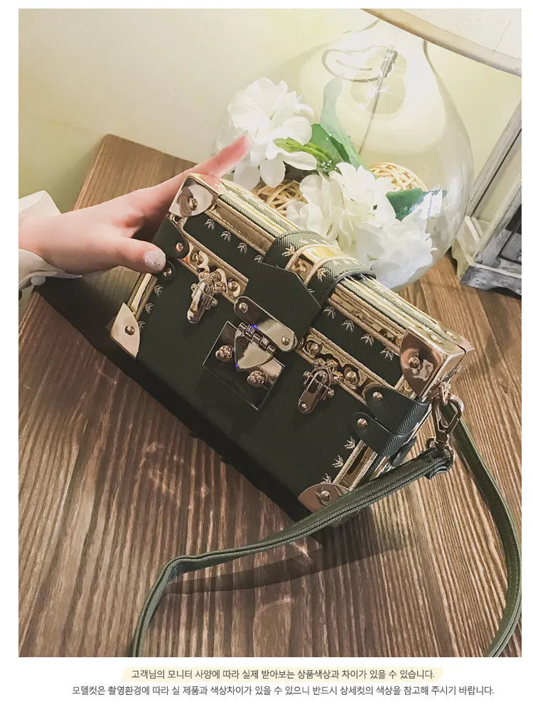 Women's black PU leather shoulder bag with flap closure and decorative rivets