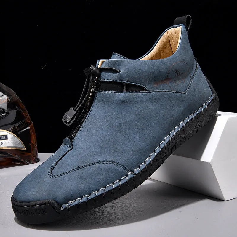 Men's casual leather shoe in green with a tall crown, round toe, mid heel, and rubber sole.