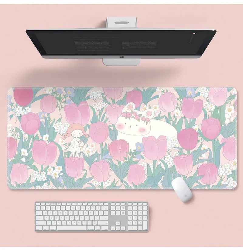 Large floral cartoon pattern mouse pad on a desk, showing non-slip rubber base and colourful design.