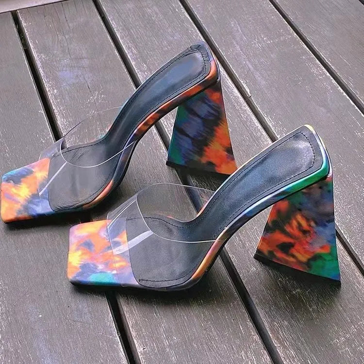 Women's black square toe slippers with a thick triangular high heel and a rubber sole.