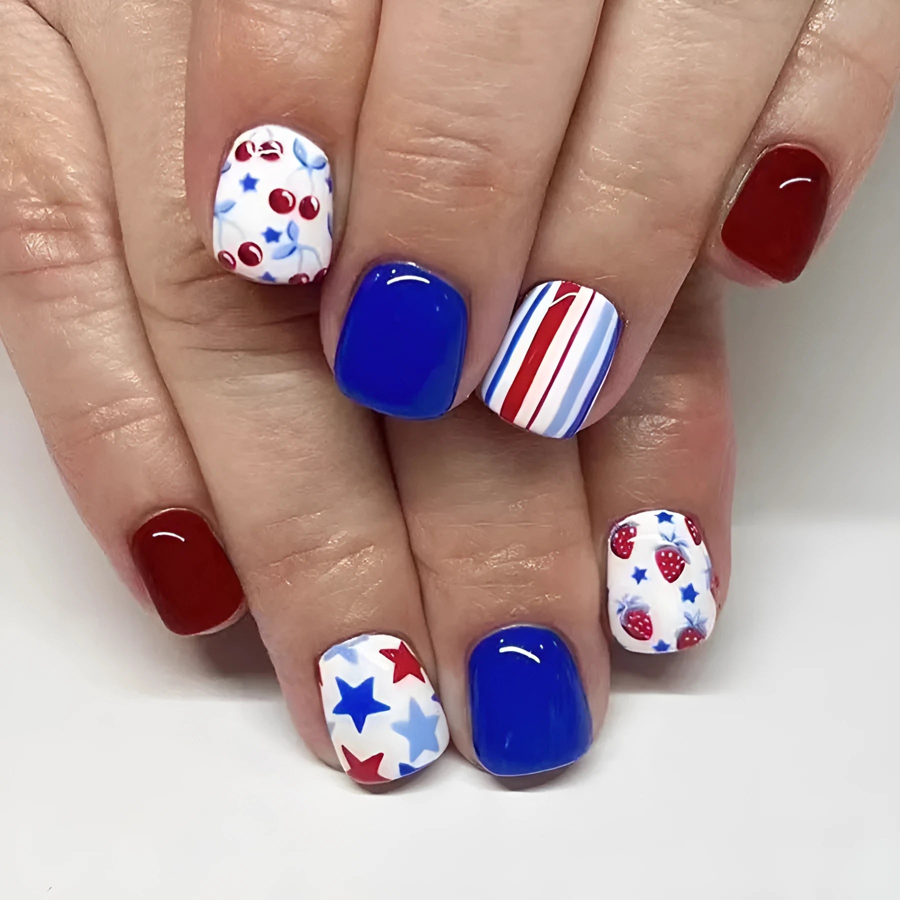 24 short glossy nail stickers with strawberry cherry Independence Day pattern in red and blue