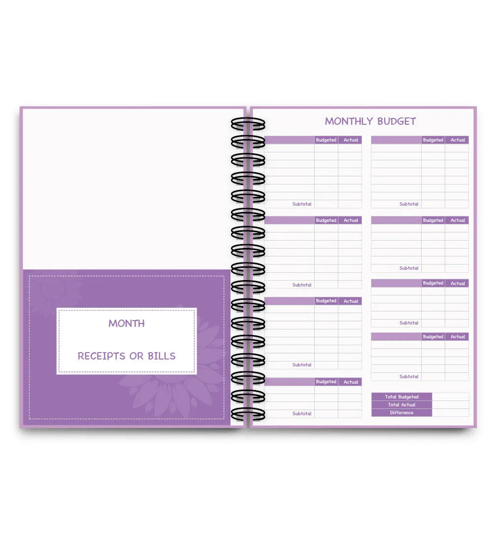 Purple coil-bound financial planning notebook with budget stickers and paper clips