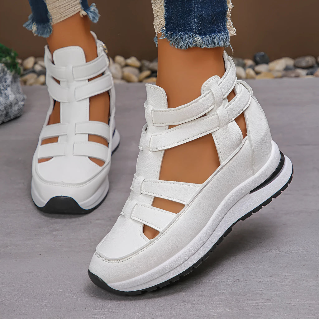 Women's black close-toed platform sandals with Velcro strap and hollow-out design.